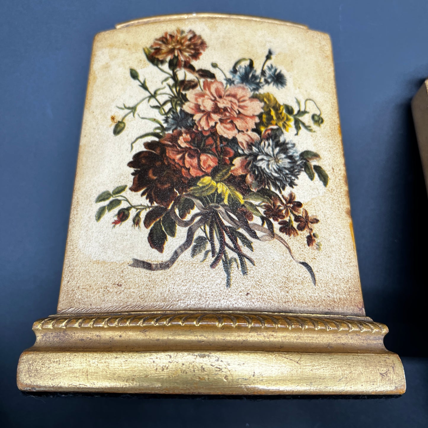 Pair of vintage MCM Borghese floral gold bookends with raised flower design for styled shelves or mid century décor.