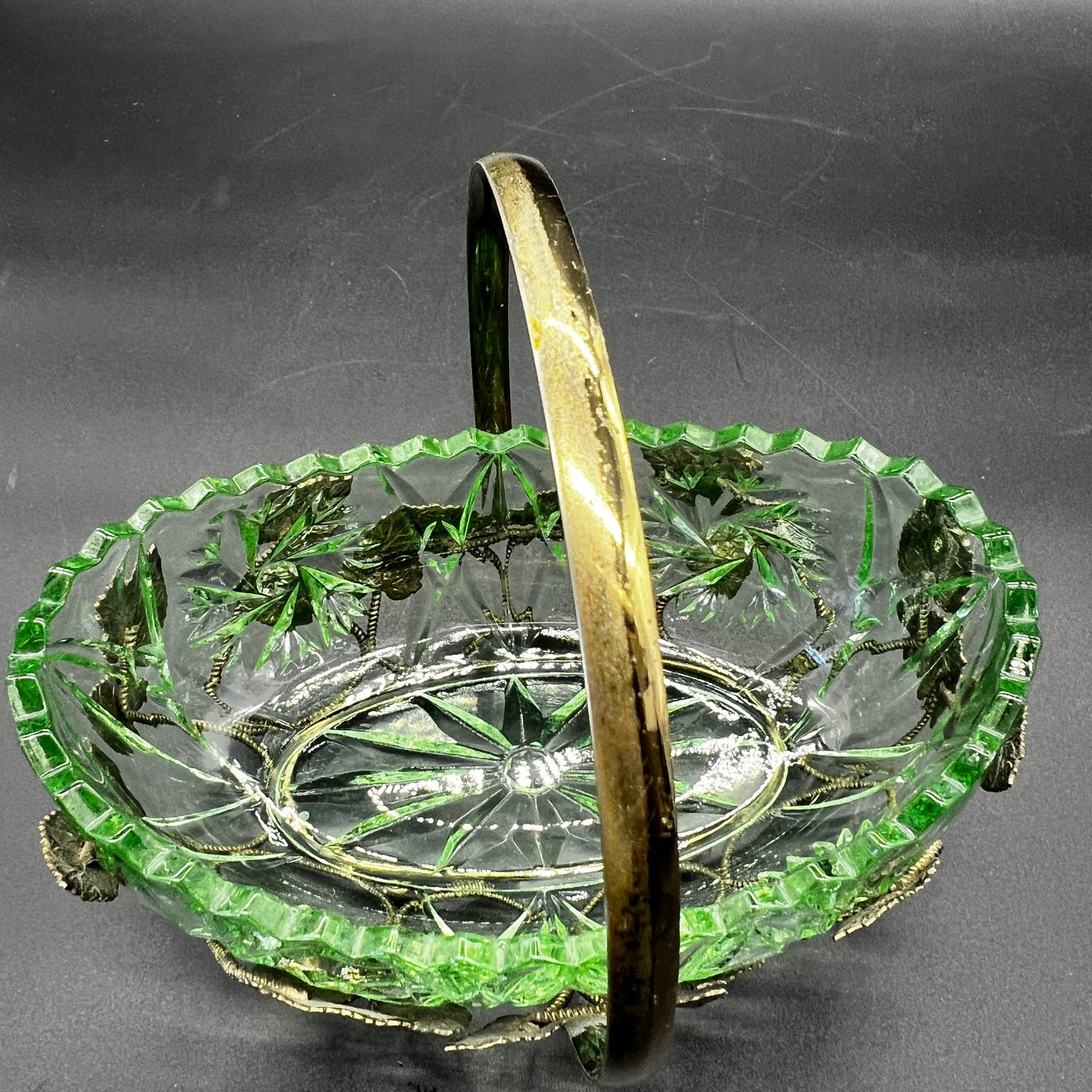 green glass bowl and ornate gold tone holder showing vintage detail