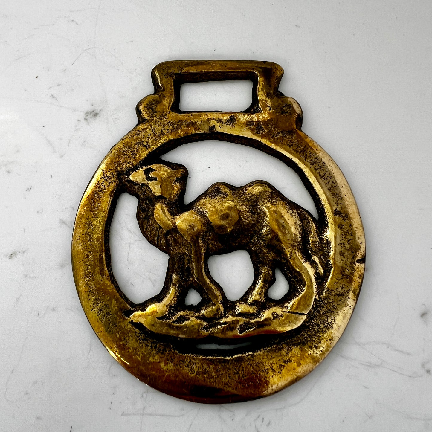 Vintage camel horse brass medallion on double-strand neutral beaded necklace with caramel leather connector.