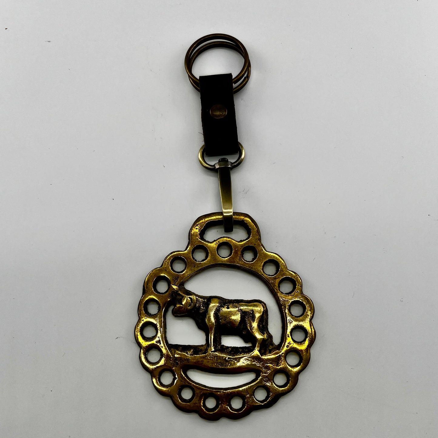 brass medallion on leather keychain