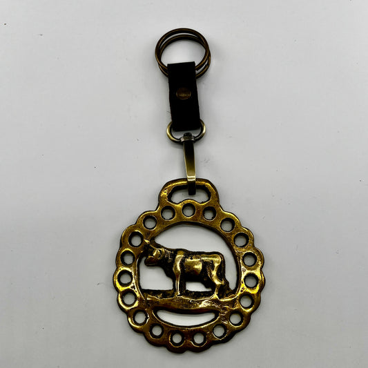 brass medallion on leather keychain