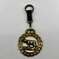 brass medallion on leather keychain