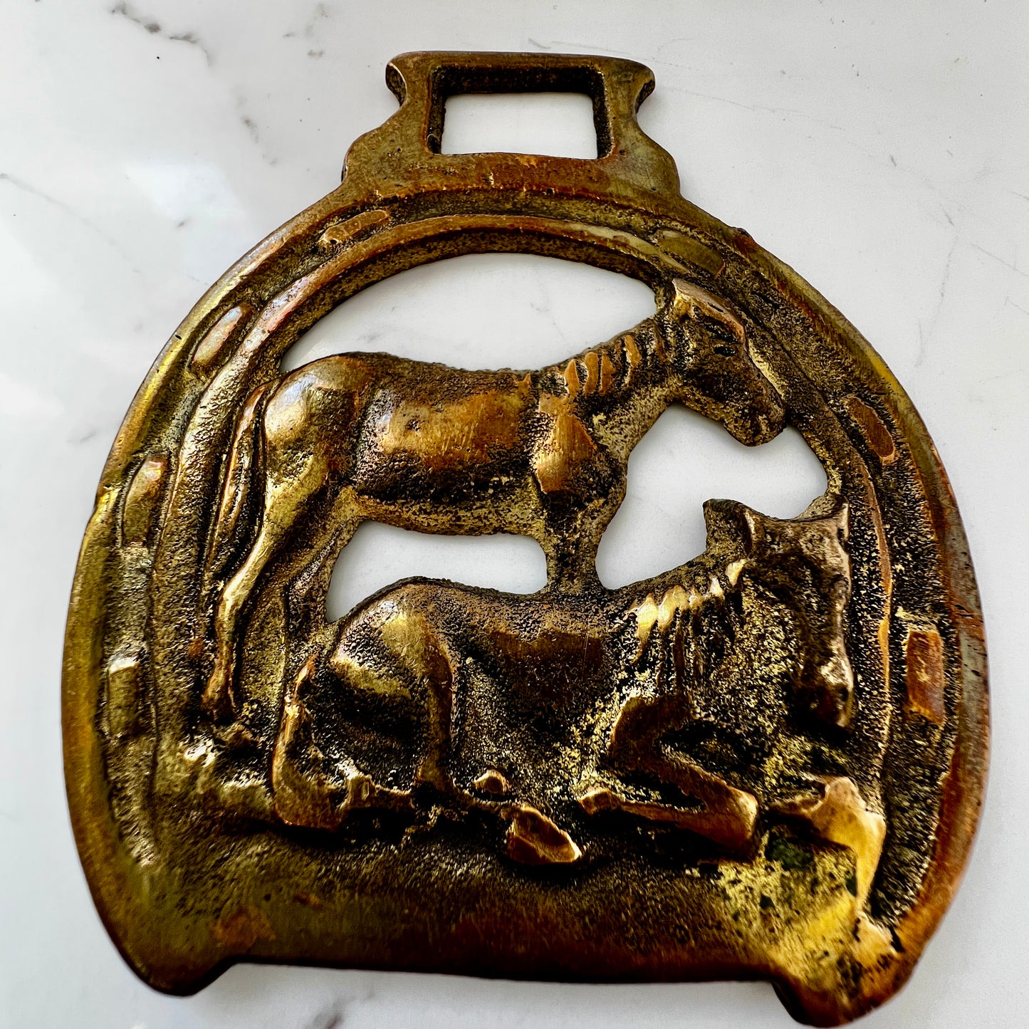 Vintage brass horse medallion featuring two Dartmoor ponies, ideal for wearing as a scarf pendant.