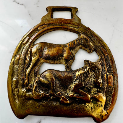 Vintage brass horse medallion featuring two Dartmoor ponies, ideal for wearing as a scarf pendant.
