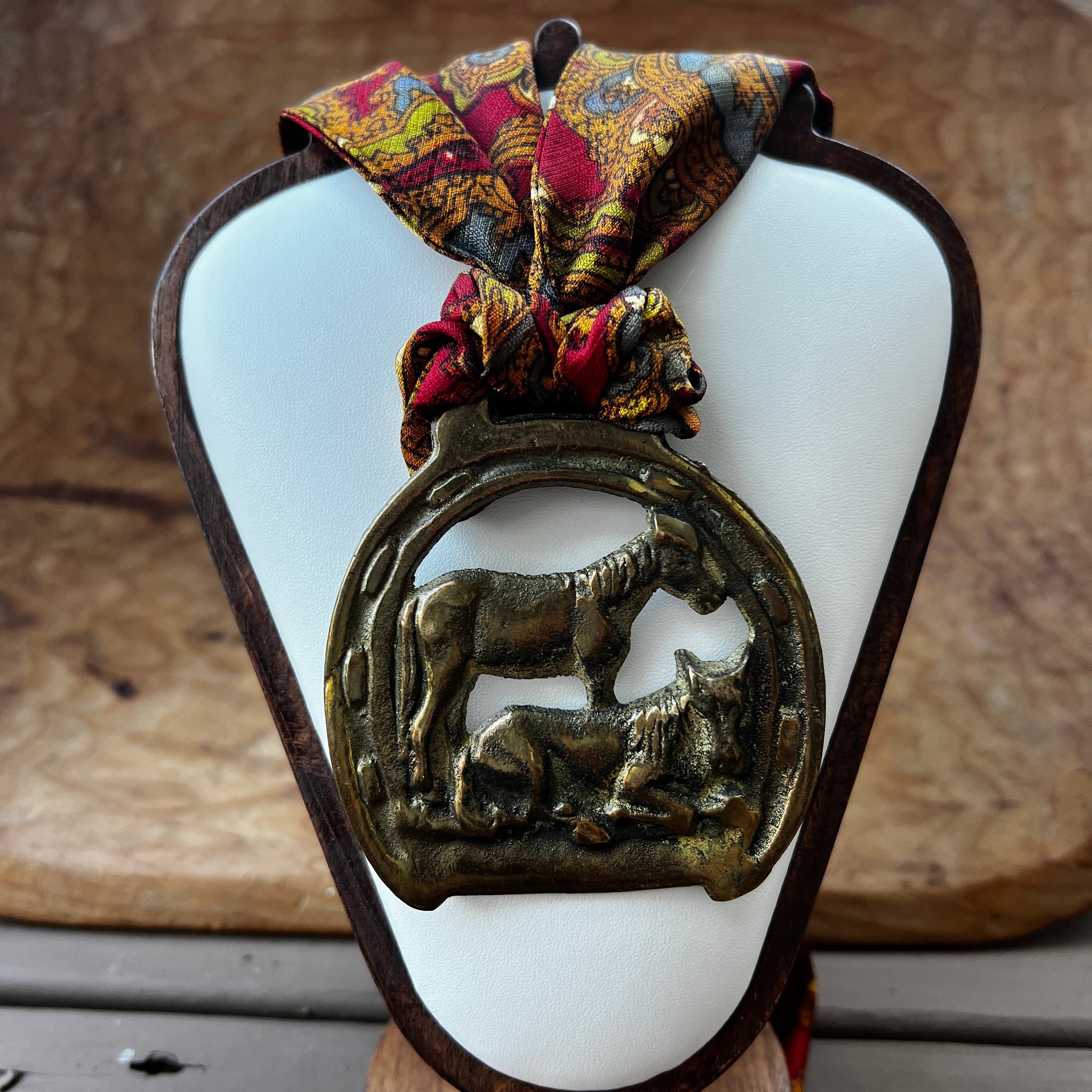 Vintage horse brass medallion necklace with paisley scarf, equestrian boho jewelry.