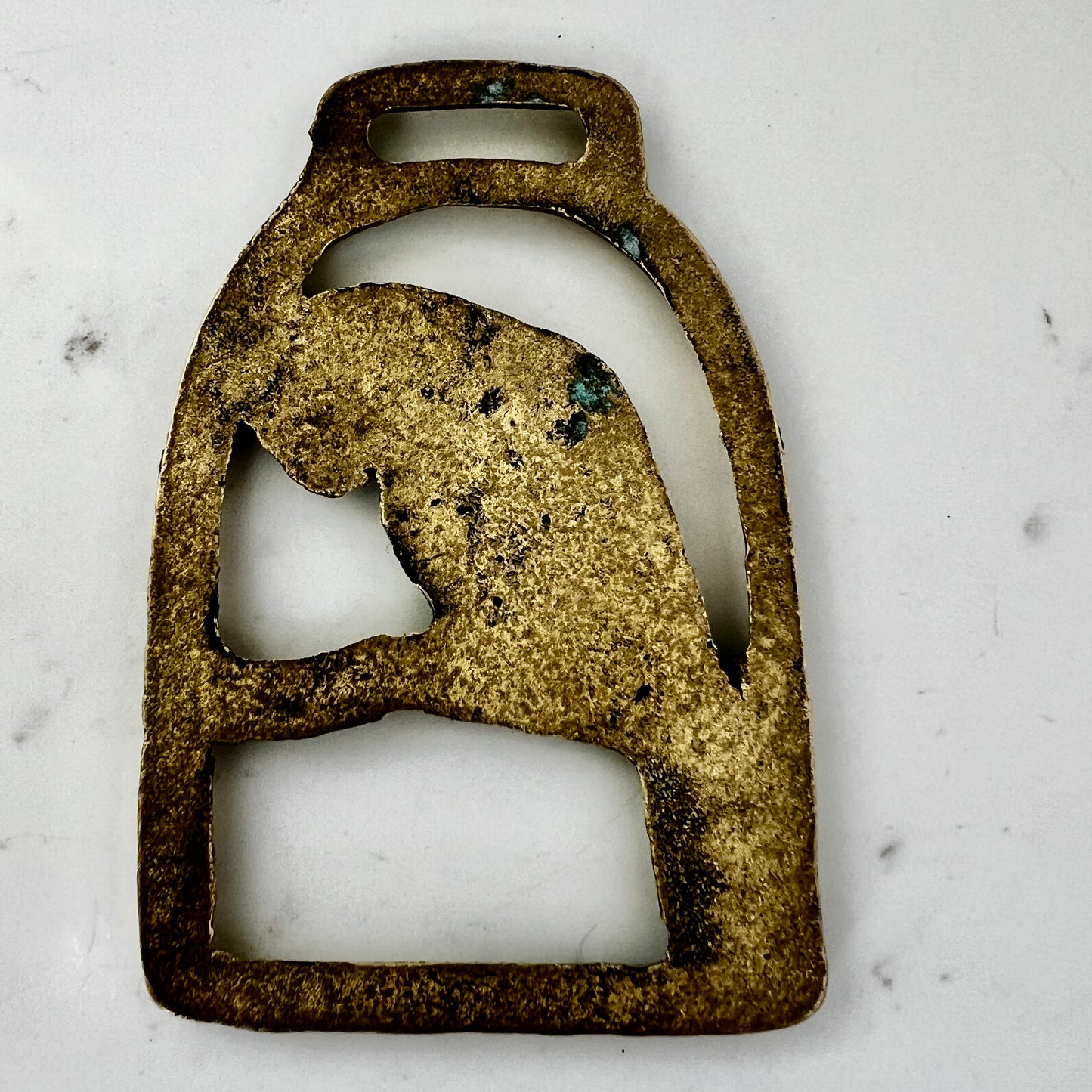 back of Vintage parrot brass medallion 