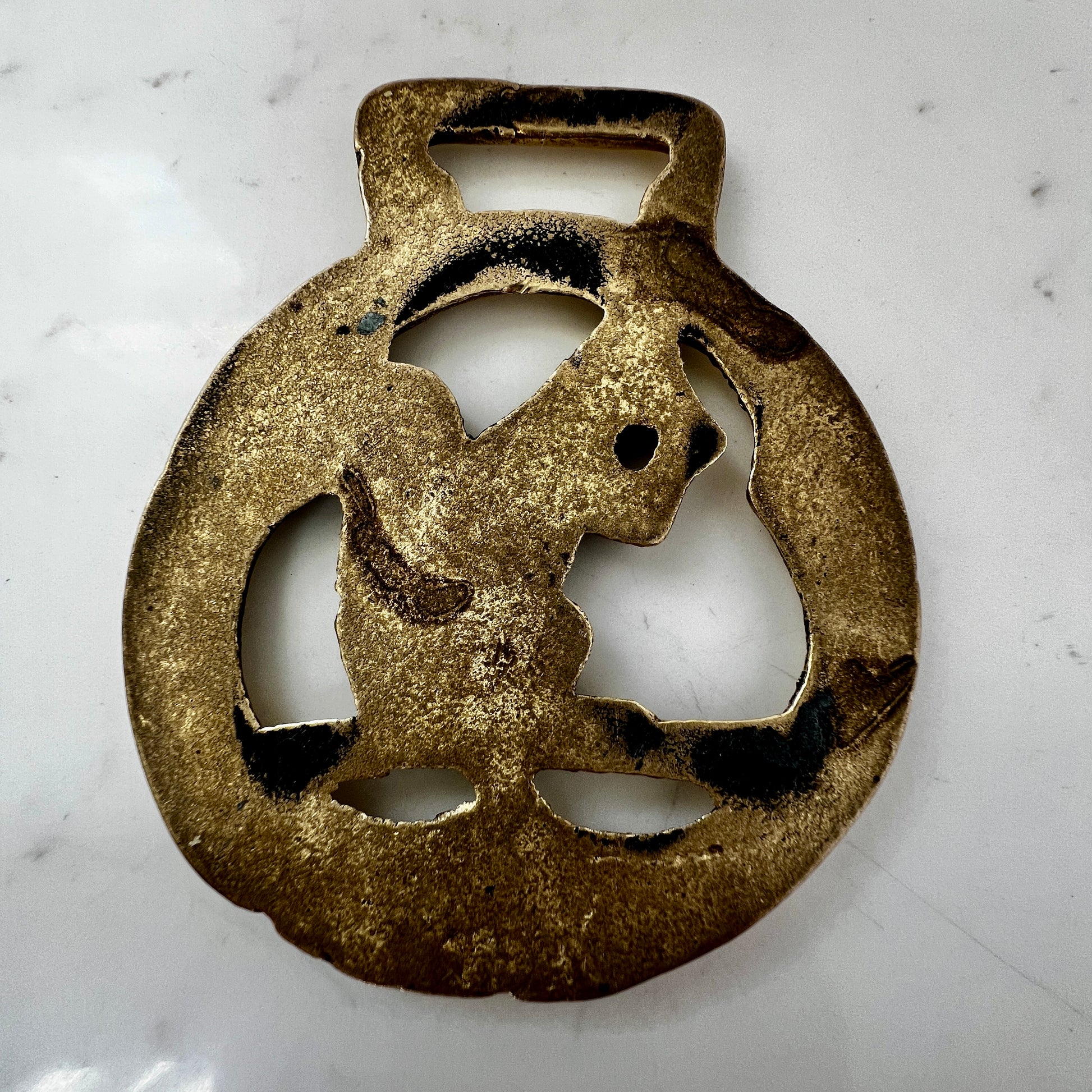 Vintage squirrel brass horse medallion on multi-strand black and silver beaded necklace with leather connector.