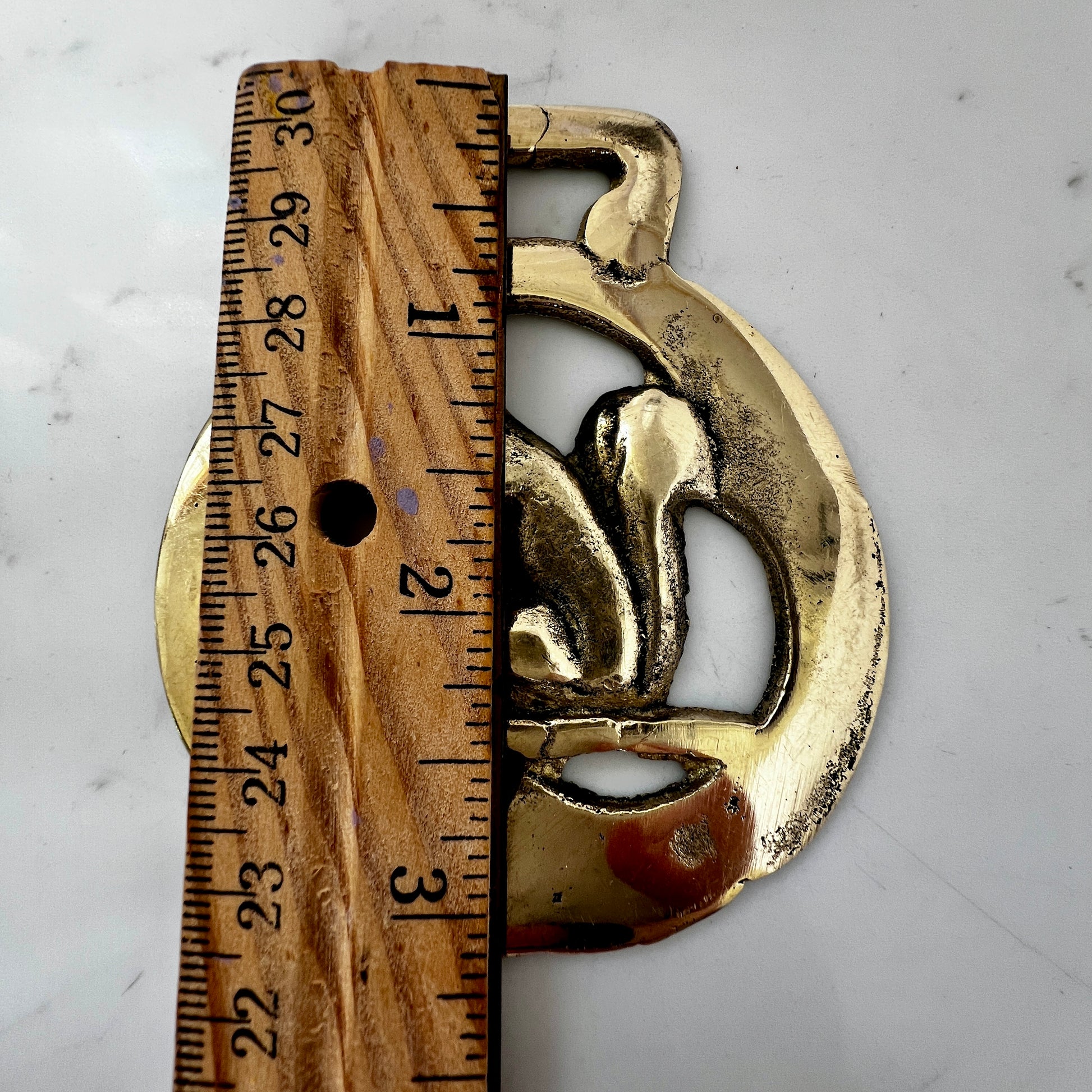 Vintage squirrel brass horse medallion on multi-strand black and silver beaded necklace with leather connector.