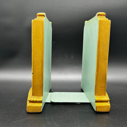 Side view of MCM Borghese floral gold bookends showing sculpted detail and mid century profile.