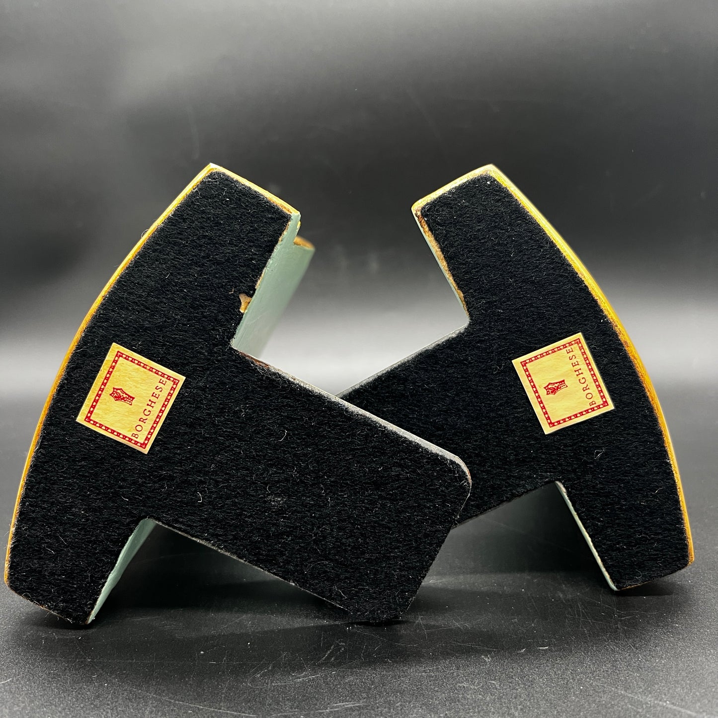 Base and back of vintage Borghese floral bookends showing aged gold finish and vintage wear.