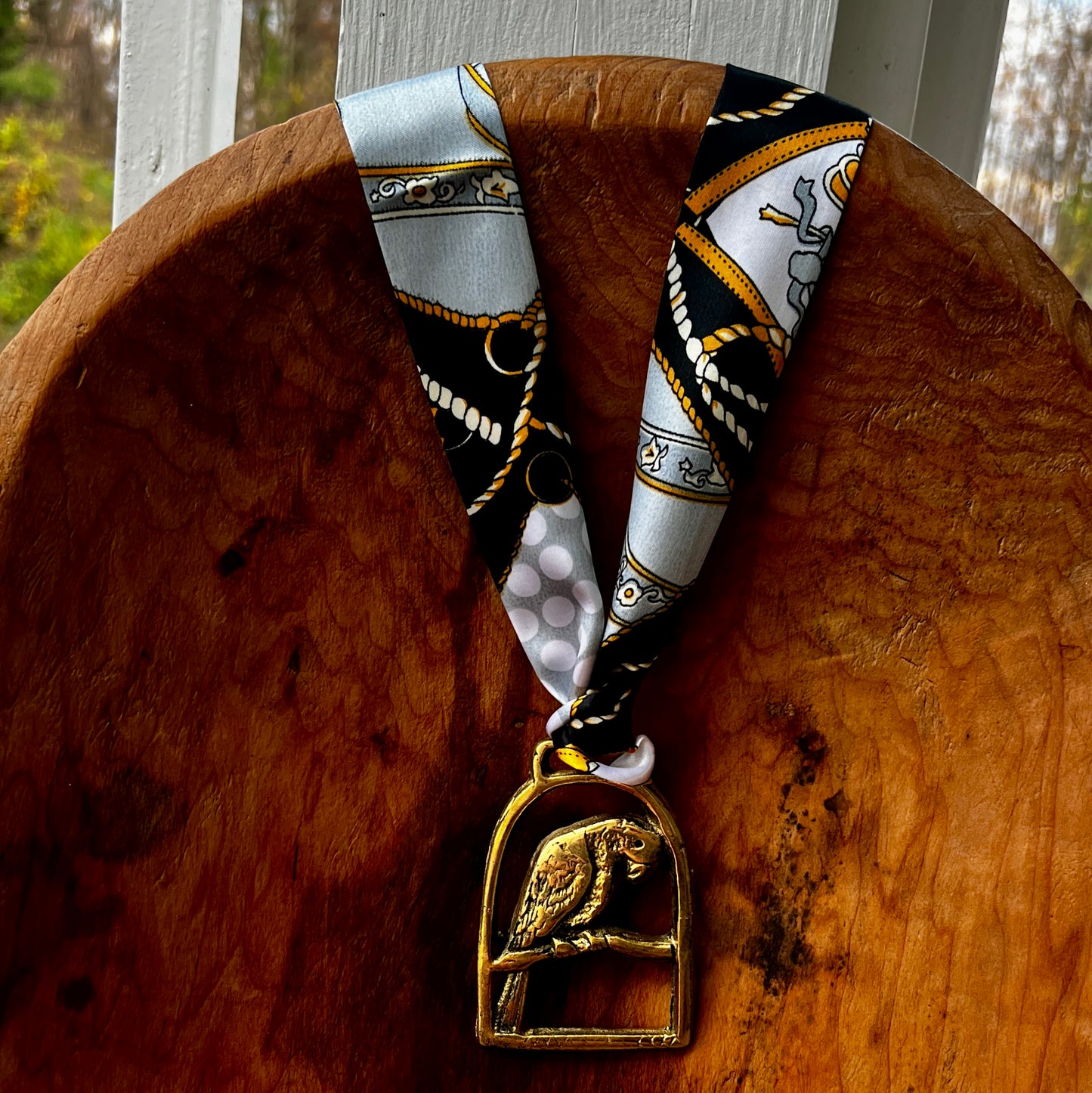 Vintage parrot brass medallion necklace with black and gold scarf, boho eclectic jewelry.