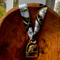 Vintage parrot brass medallion necklace with black and gold scarf, boho eclectic jewelry.