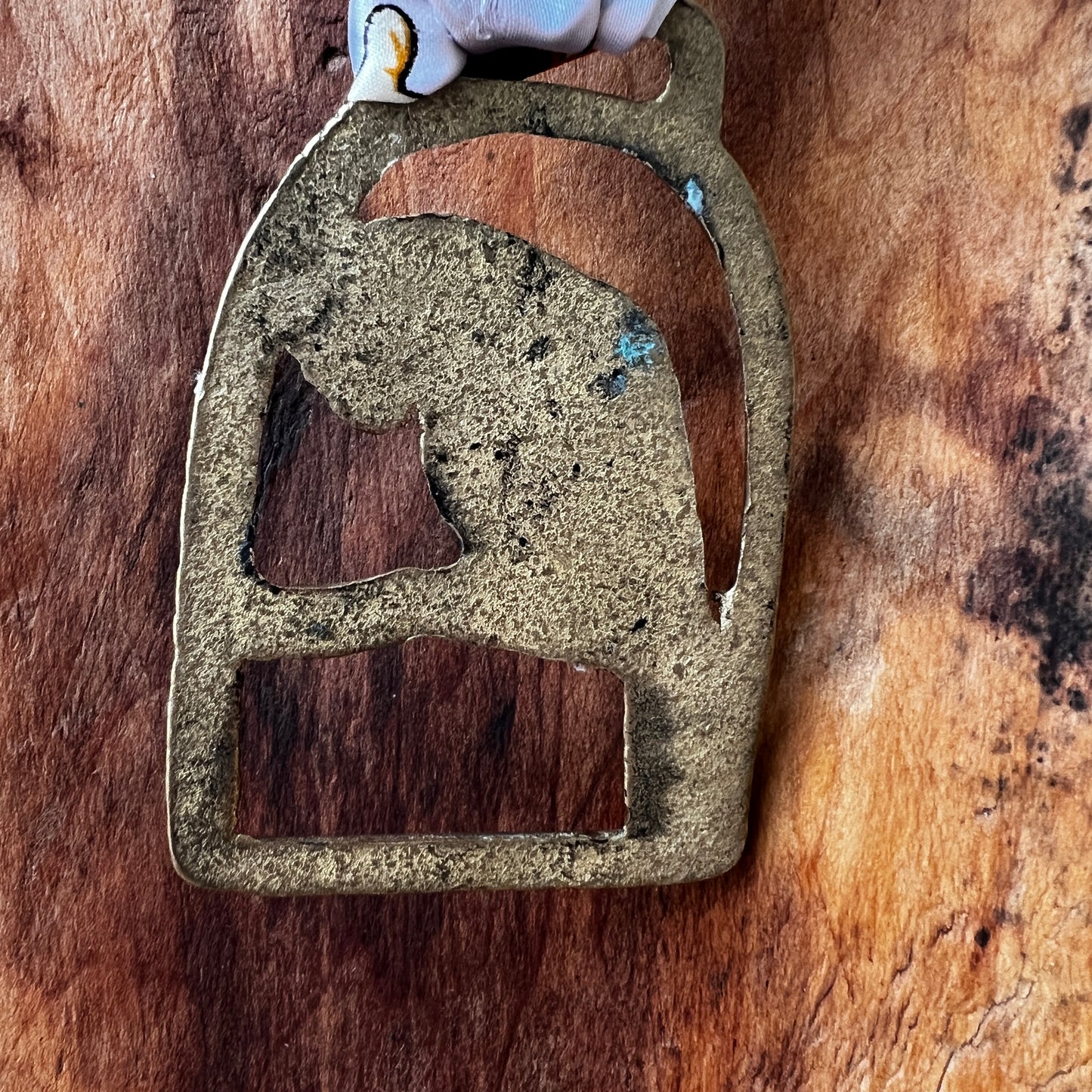 Back of Vintage parrot brass medallion necklace with black and gold scarf, boho eclectic jewelry.