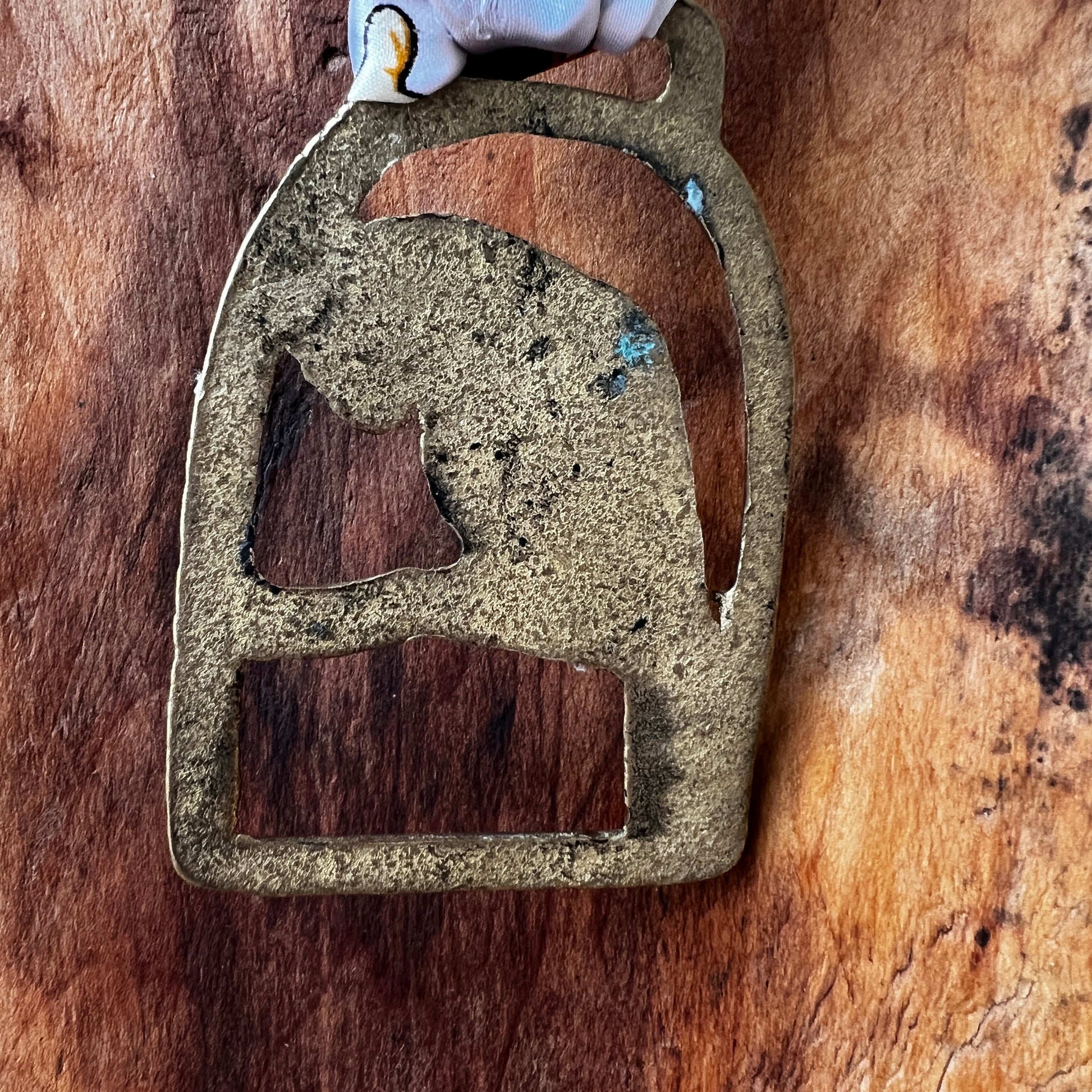 Back of Vintage parrot brass medallion necklace with black and gold scarf, boho eclectic jewelry.