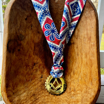 Vintage Masonic square and compass brass medallion necklace with red white blue scarf.