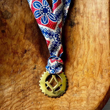 Vintage Masonic square and compass brass medallion necklace with red white blue scarf.