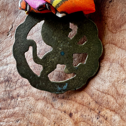 Back of Vintage Red Lion London brass medallion 