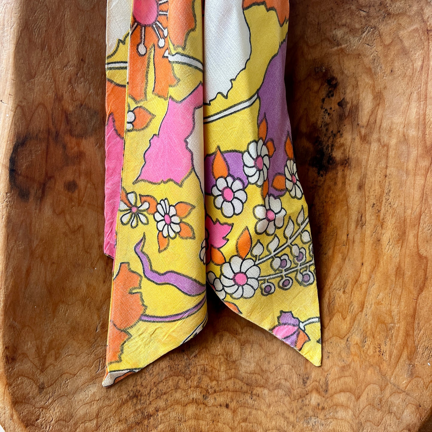 Vintage Red Lion London brass medallion necklace with bright retro floral scarf.