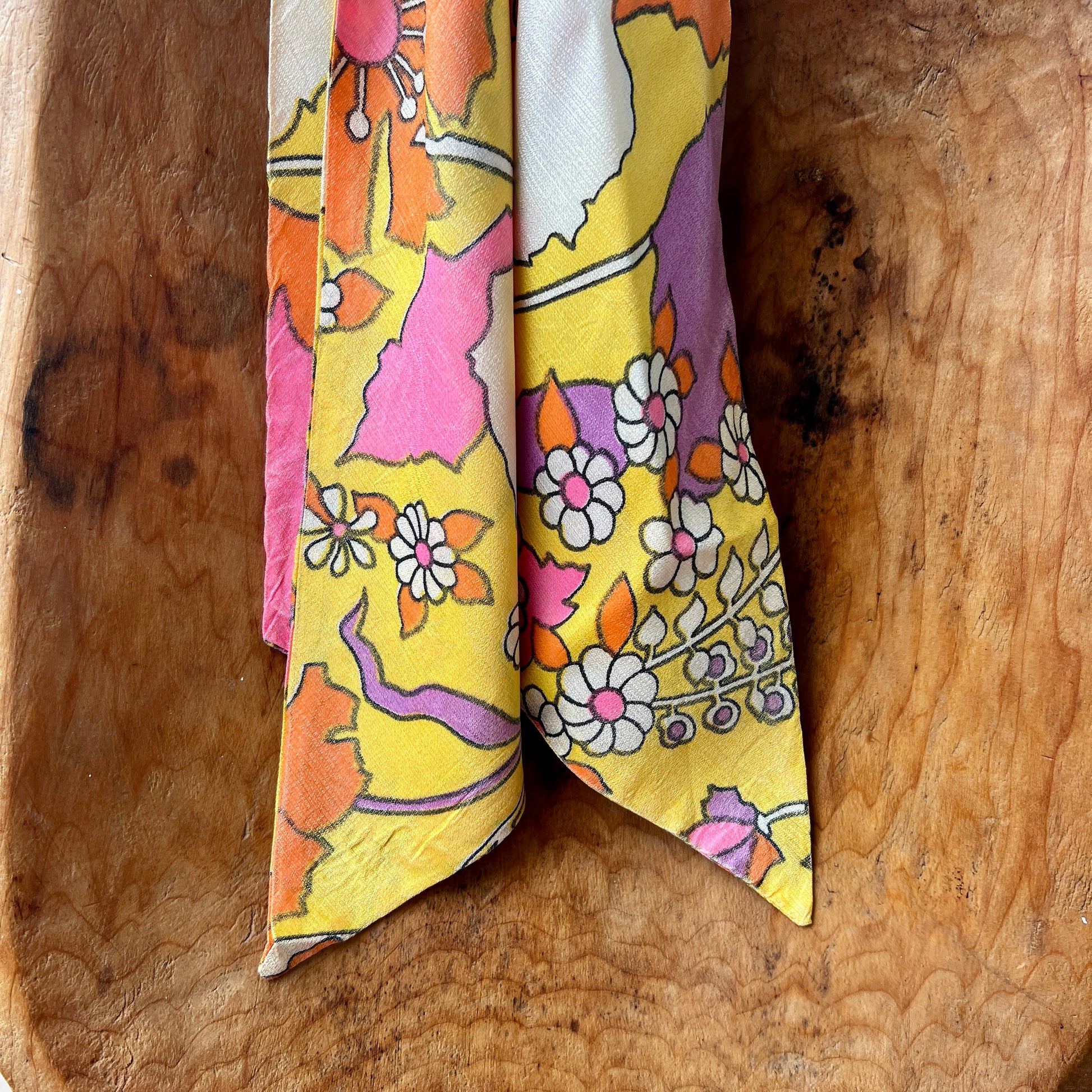 Vintage Red Lion London brass medallion necklace with bright retro floral scarf.