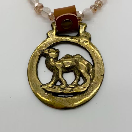 Vintage camel horse brass medallion on double-strand neutral beaded necklace with caramel leather connector.