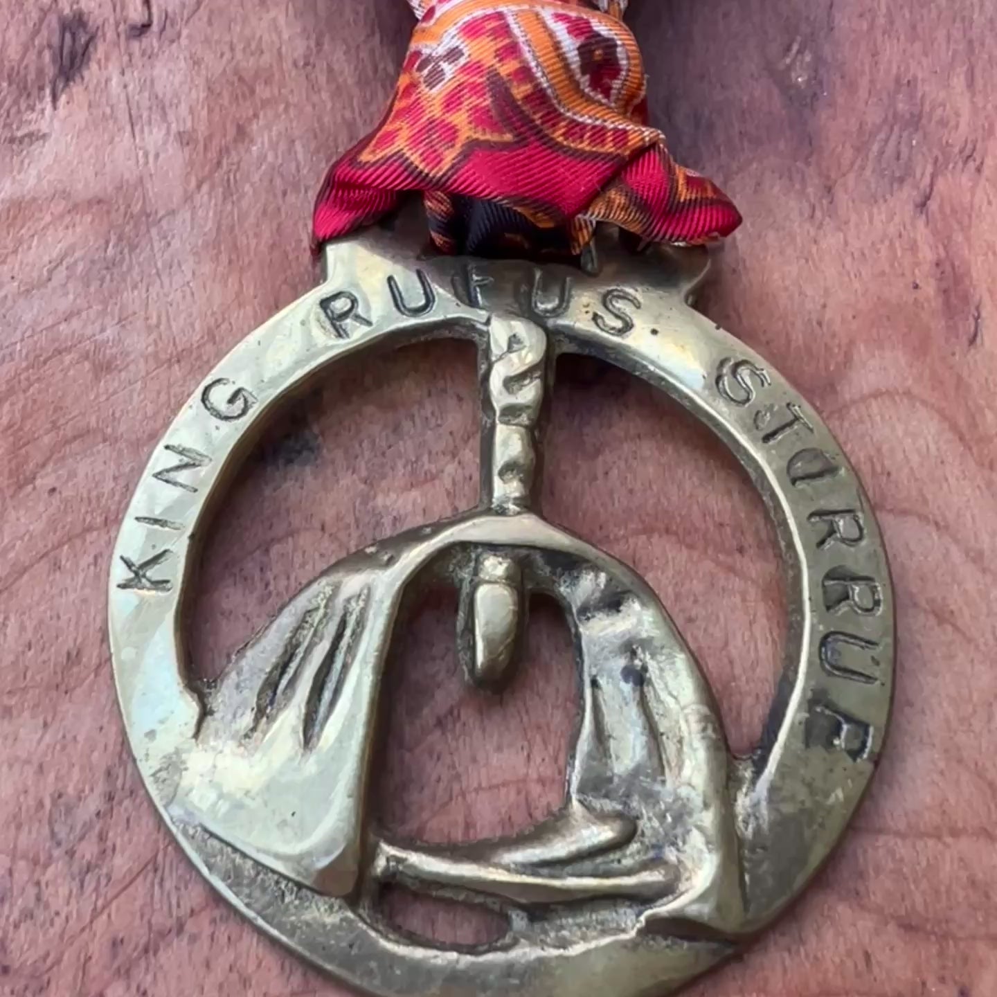 Video Vintage King Rufus Stirrup brass medallion necklace with red paisley scarf, equestrian jewelry.