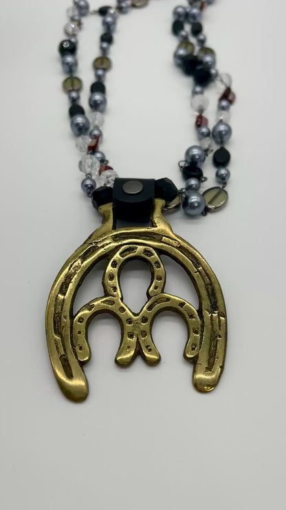 Vintage Horse Brass Medallion Necklace – Double Horseshoe Pendant on Dark Multi-Strand Beads