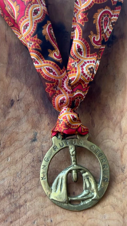 Video Vintage King Rufus Stirrup brass medallion necklace with red paisley scarf, equestrian jewelry.