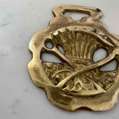 Vintage scythe and wheat horse brass medallion attached to triple-strand black and cream beaded necklace with leather connector. VIDEO